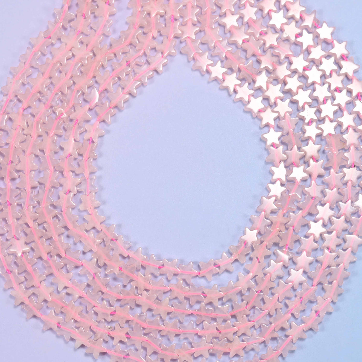 Flat star cut rose quartz beads