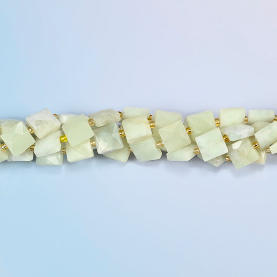 Strands of New Jade faceted flat square beads twisted together in a horizontal row