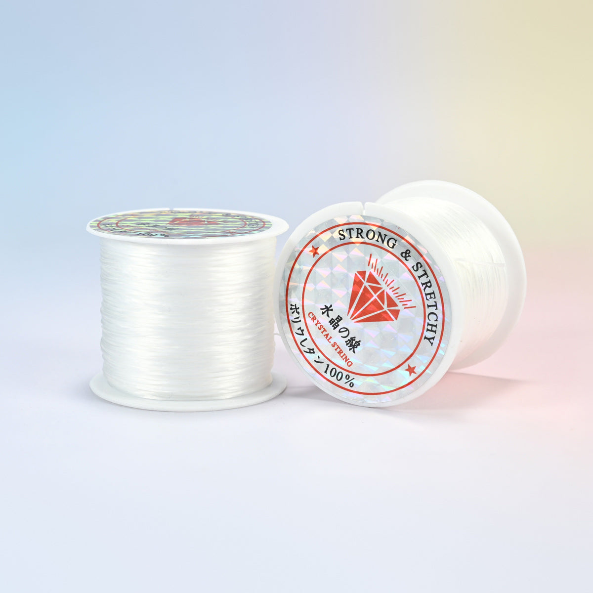 Two rolls of clear 0.7-0.8mm elastic stretch string, glossy polyurethane bead cord with a holographic label