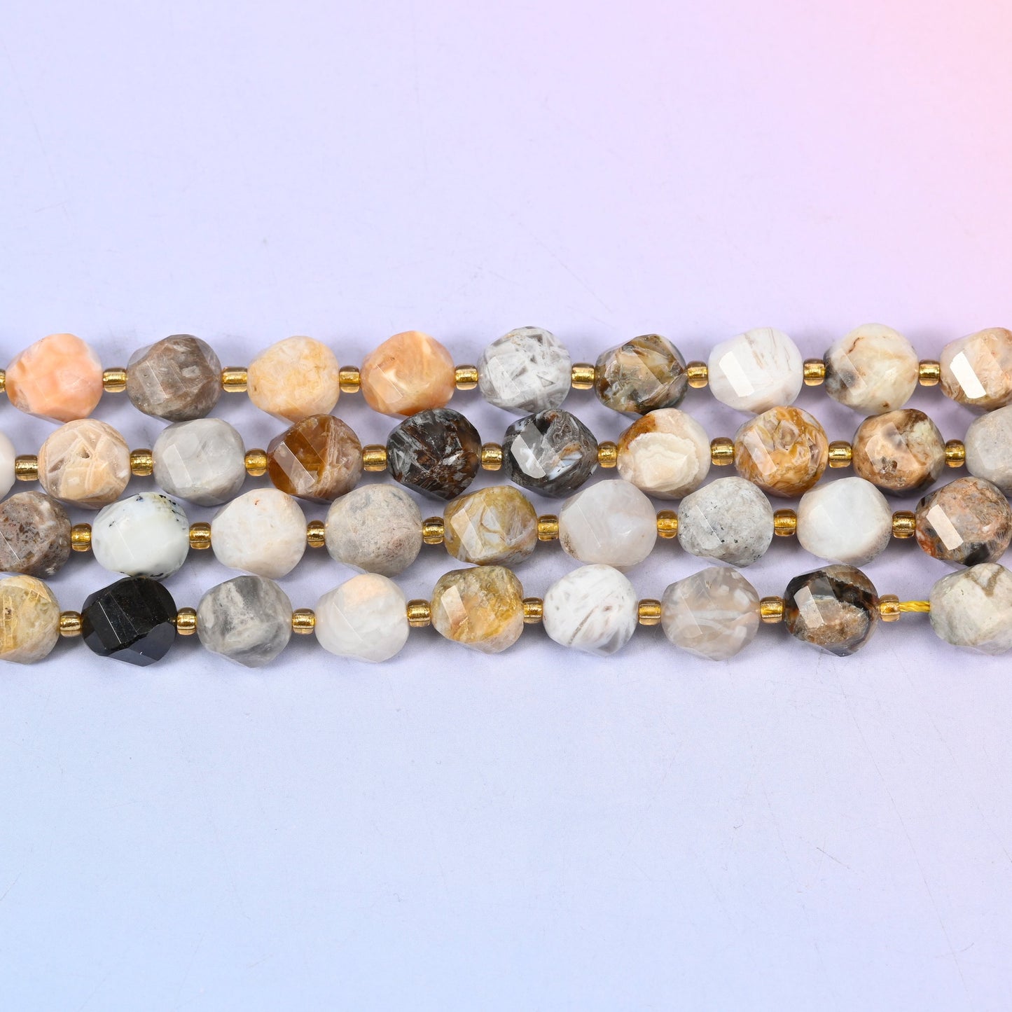 Bamboo Agate natural stone beads running from near-white through tan and apricot to the occasional dark grey