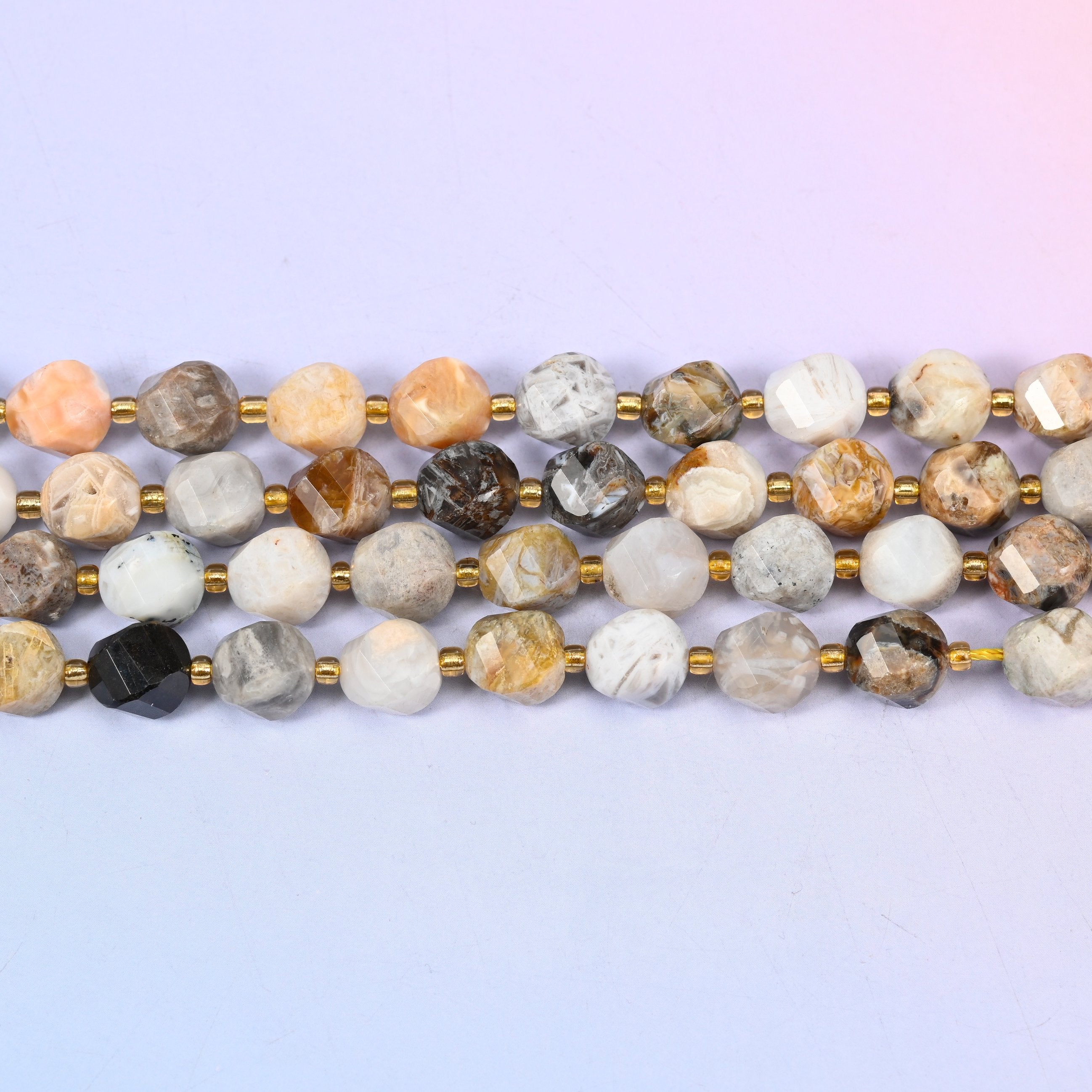 Bamboo Agate natural stone beads running from near-white through tan and apricot to the occasional dark grey