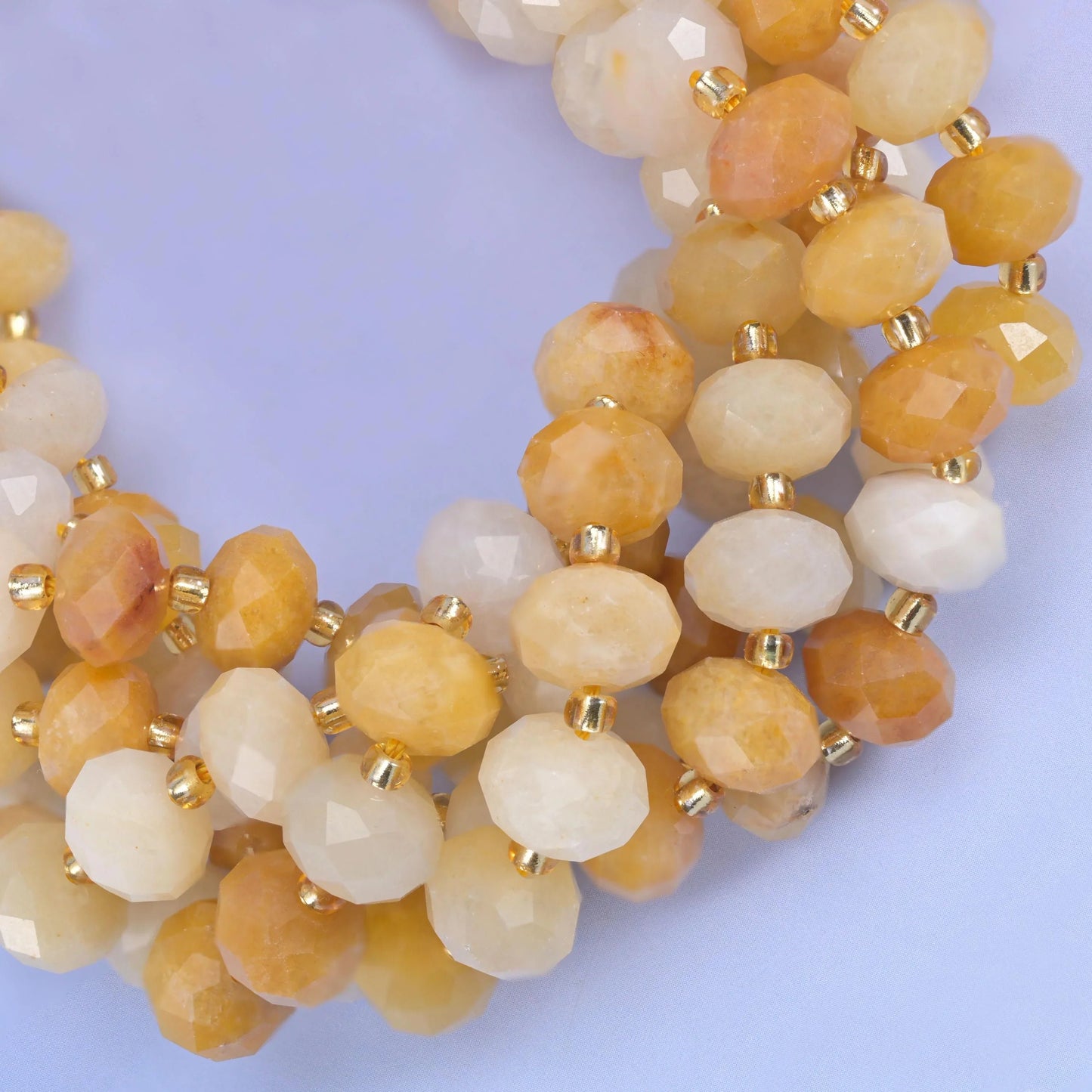 Faceted rondelle cut yellow jade beads