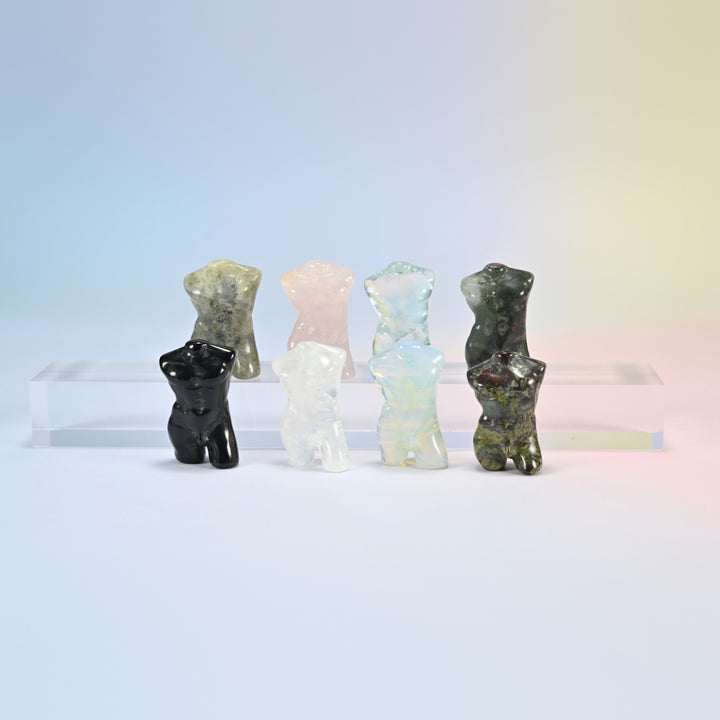 Eight 1.3 inch male goddess crystal carvings on a stand, male torso figurines in natural stones, opalite and aqua blue glass
