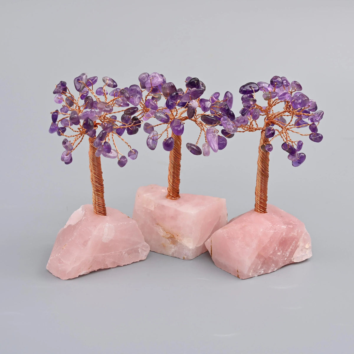 4 inch gemstone tree; natural rose quartz base, so size and depth of pink vary piece to piece
