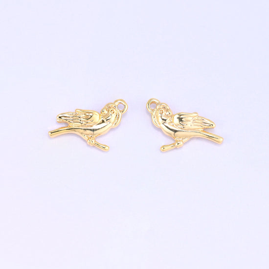 Small gold charms bird, two 18K gold plated charms side by side showing the double sided design