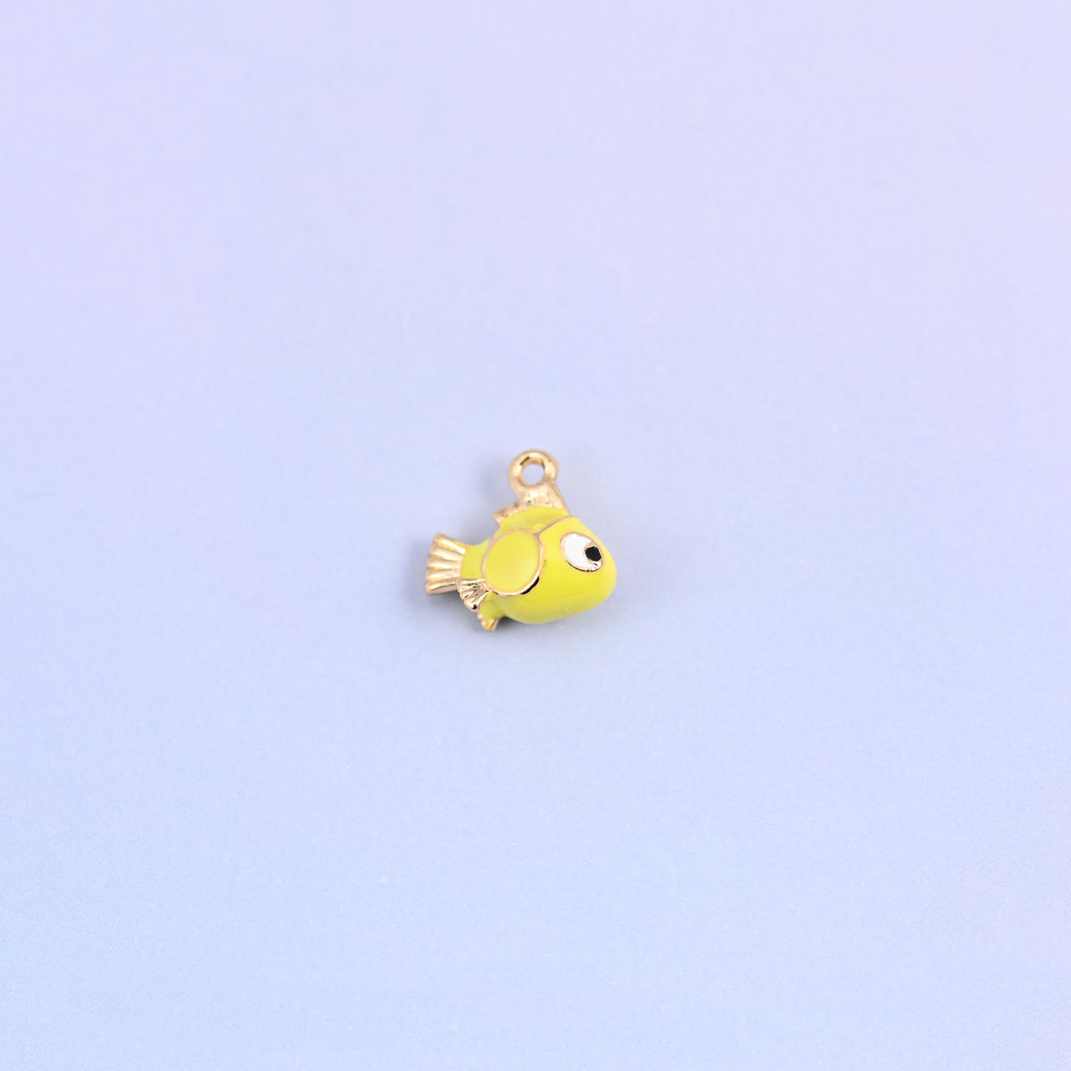 Fish charm in profile, 12.27 x 11.58mm with a small ring for a jump ring or chain.