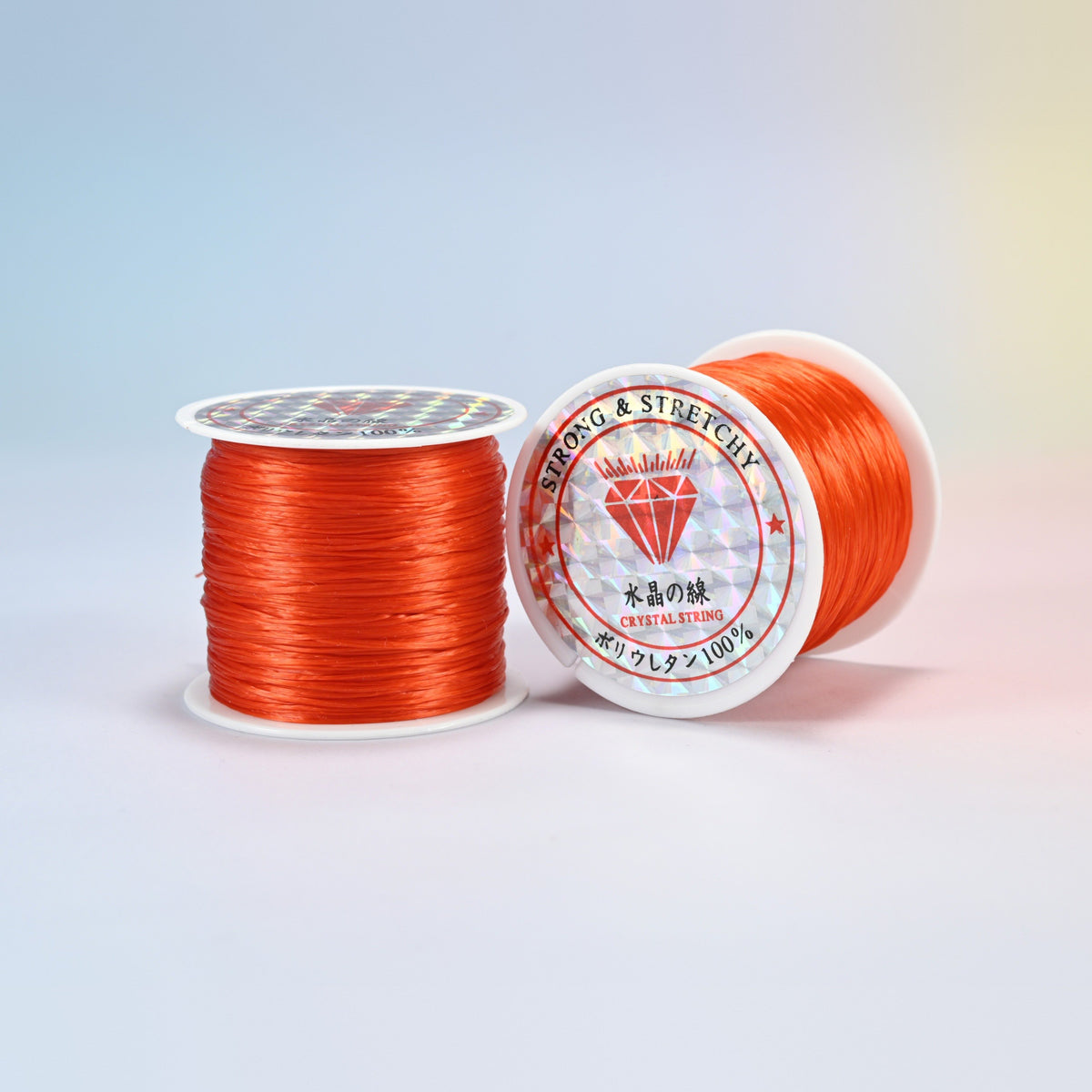 Two rolls of red orange 0.7-0.8mm elastic stretch string, glossy polyurethane bead cord with a holographic label