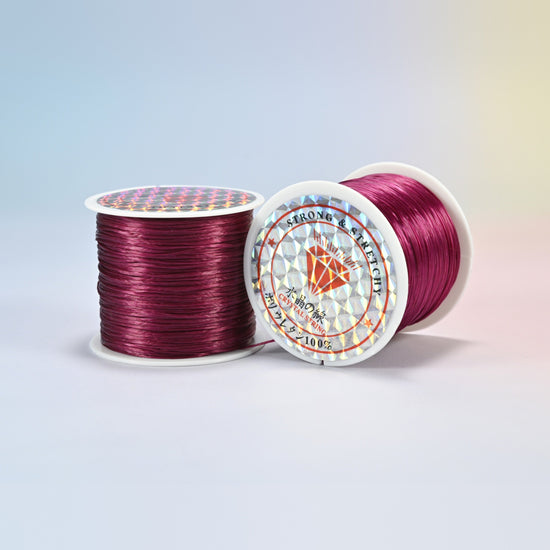 Two rolls of wine red 0.7-0.8mm elastic stretch string, glossy polyurethane bead cord with a holographic label