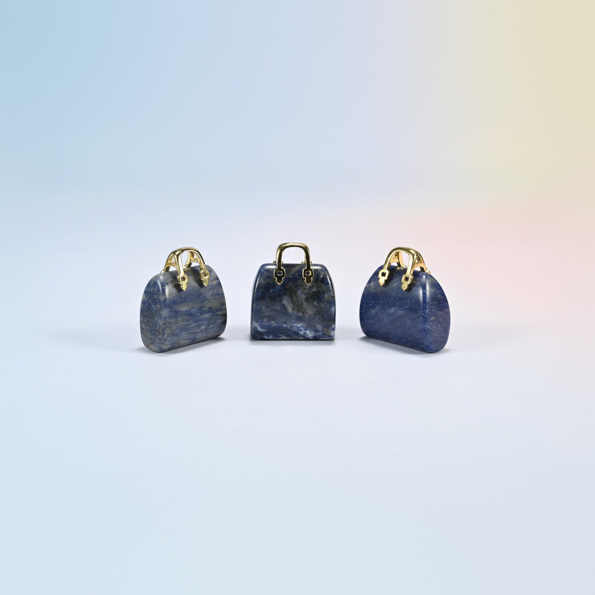 Three sodalite purse crystal carvings, 1 inch, deep blue natural stone with white veins, gold-tone handle