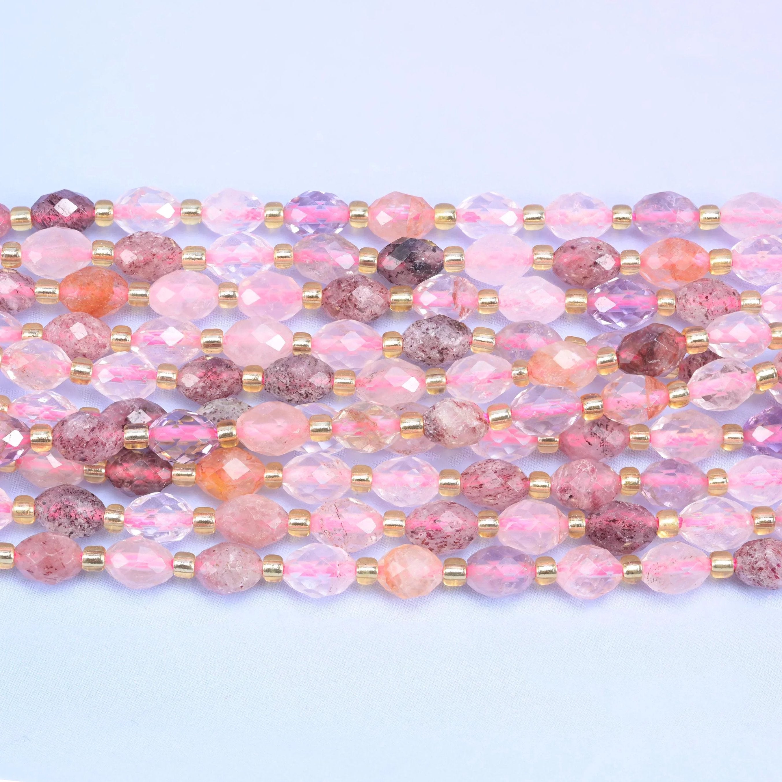 Faceted rice barrel cut strawberry phantom quartz beads