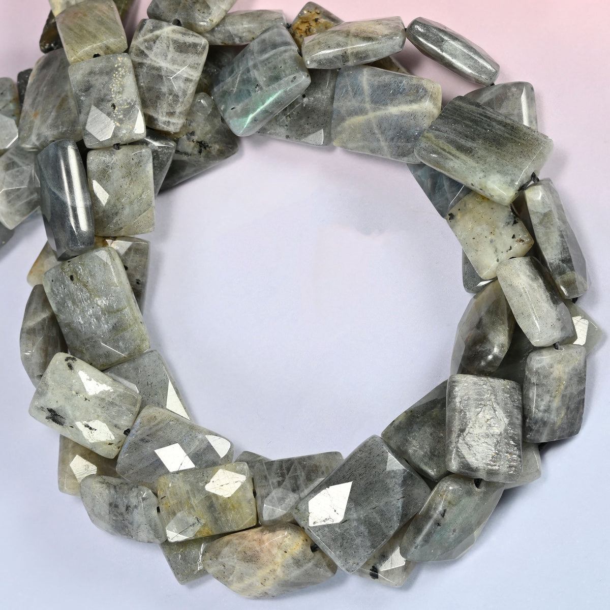 Gray Labradorite faceted flat rectangle beads coiled into a ring, small dark inclusion spots on some tablets