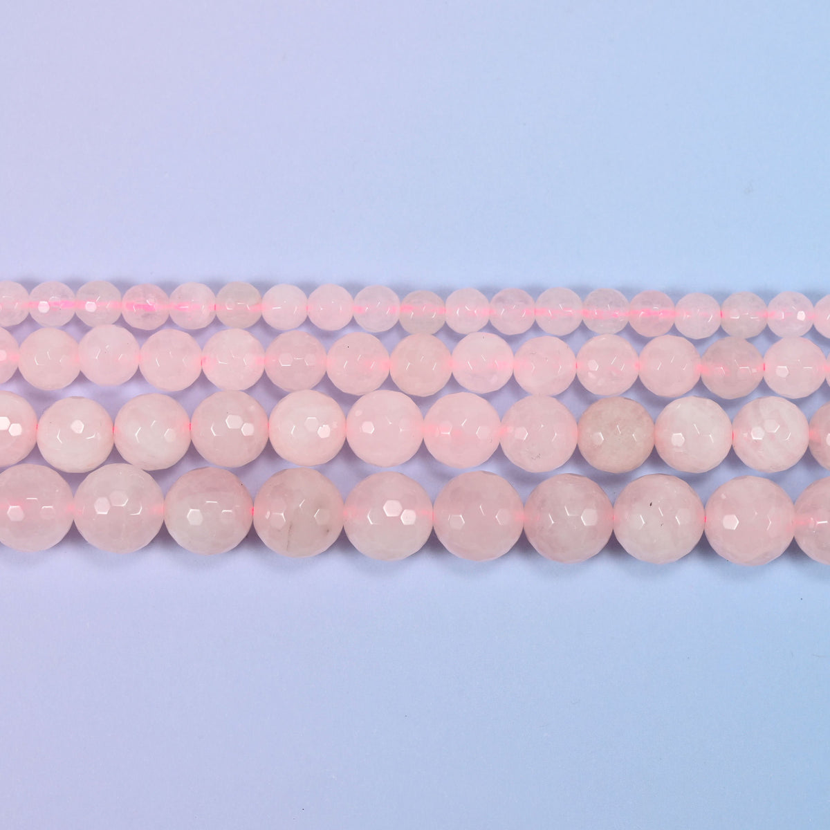 Rose quartz beads in pale blush pink, milky rather than clear
