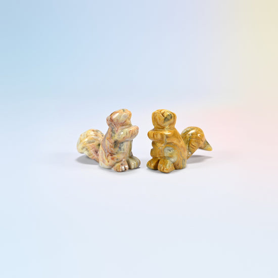 Two 2 inch natural crazy agate long tail squirrel carvings, cream, tan and yellow patterned agate