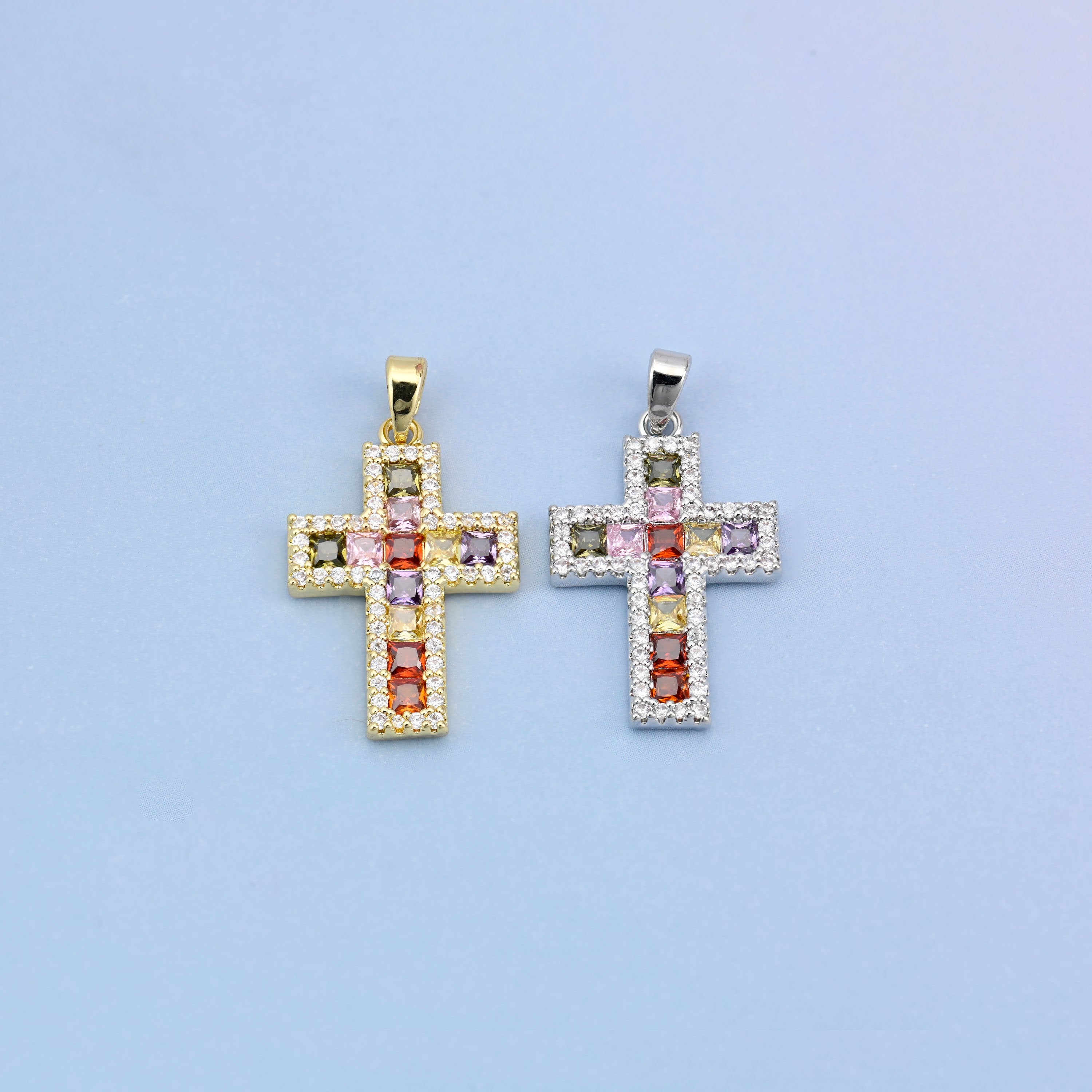 Zirconia cross charms in gold plated and white gold plated, the two finishes side by side