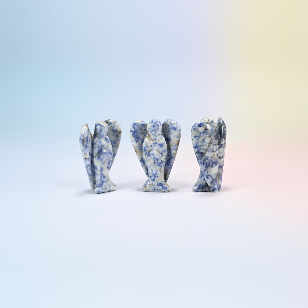 Three natural blue spot jasper guardian angel carvings, white with navy spots, 2 inch
