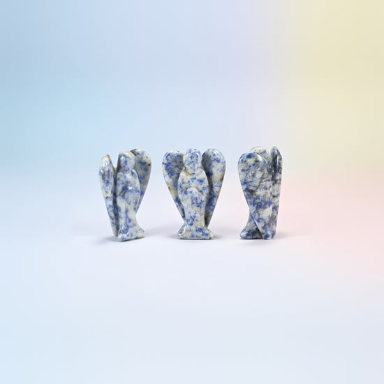 Three natural blue spot jasper guardian angel carvings, white with navy spots, 2 inch