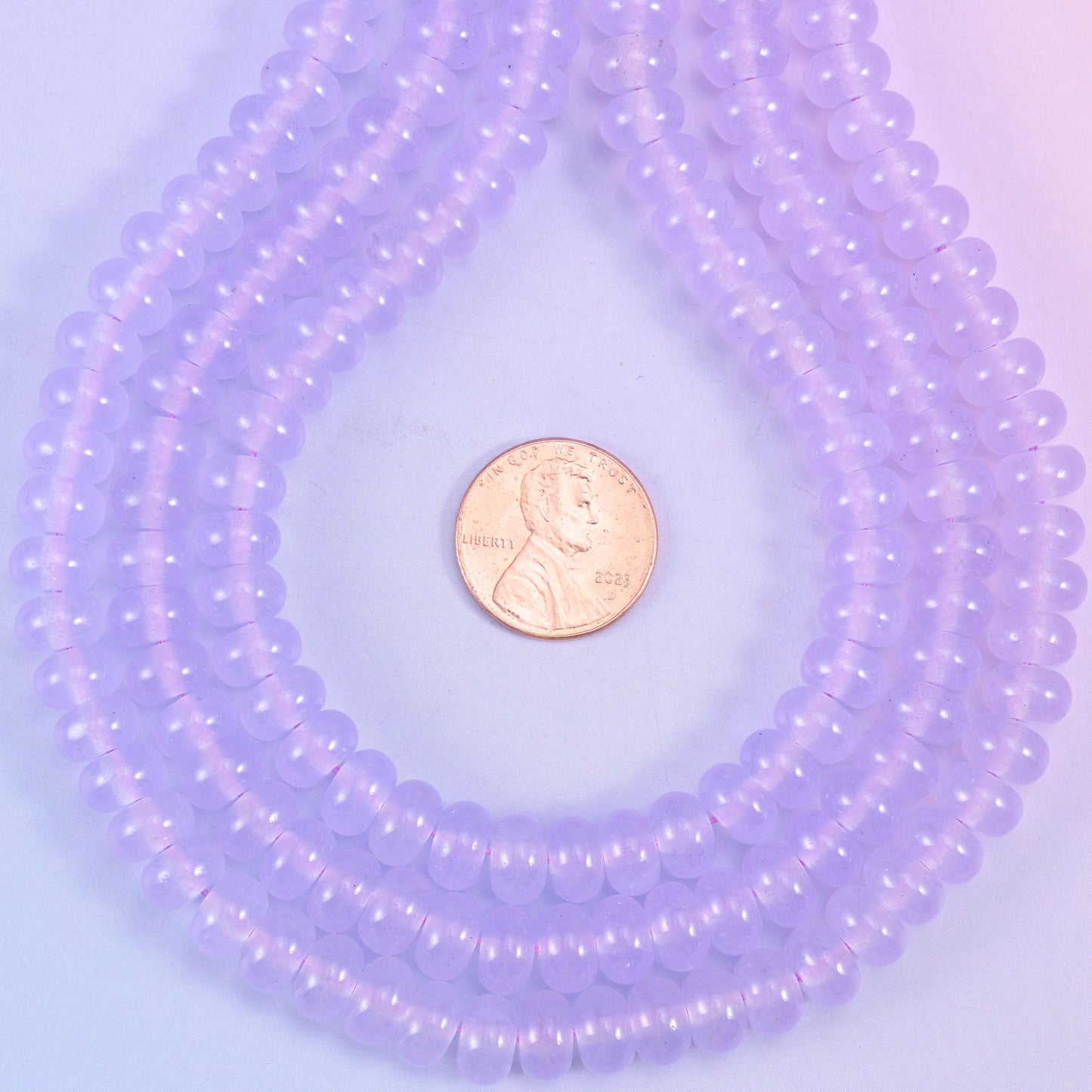 Lavender Purple Dyed Jade smooth rondelle beads in a soft, translucent lilac, finished with a smooth, polished surface