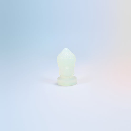 Opalite Buddha head carving, 2 inch, milky white with a soft blue glow, man-made glass