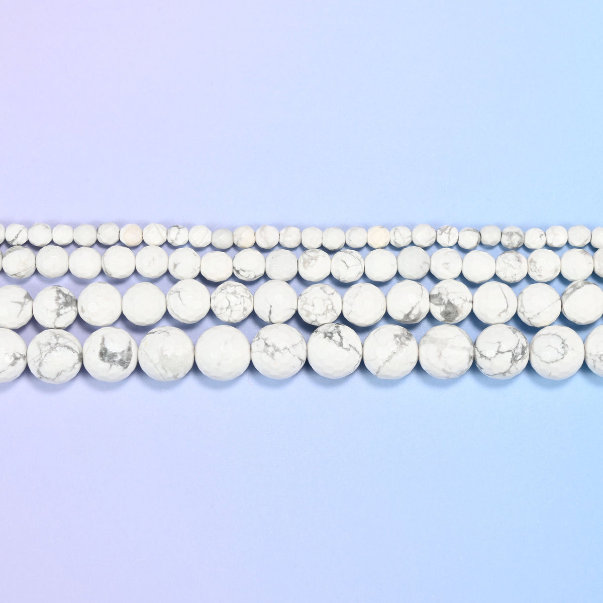 White Howlite Faceted Round Beads in chalk white with grey veining