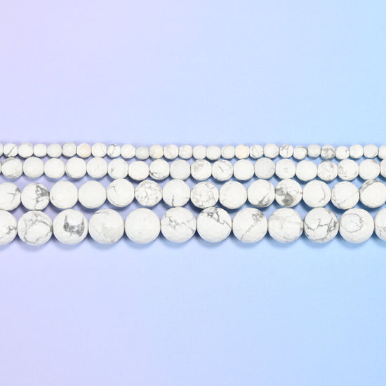 White Howlite Faceted Round Beads in chalk white with grey veining