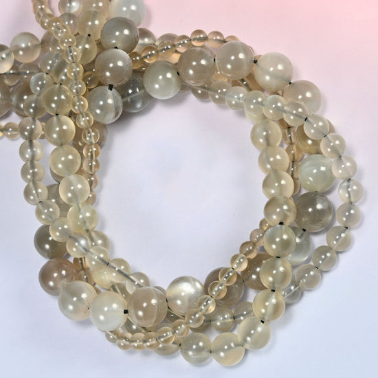 AAA Gray Labradorite smooth round beads coiled into a ring, small dark specks on a few beads