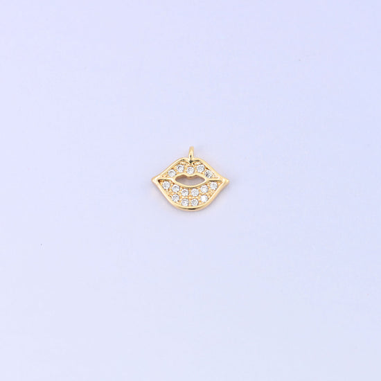 Small gold charms in a lip shape, 18K gold plated brass with clear cubic zirconia, single charm front view