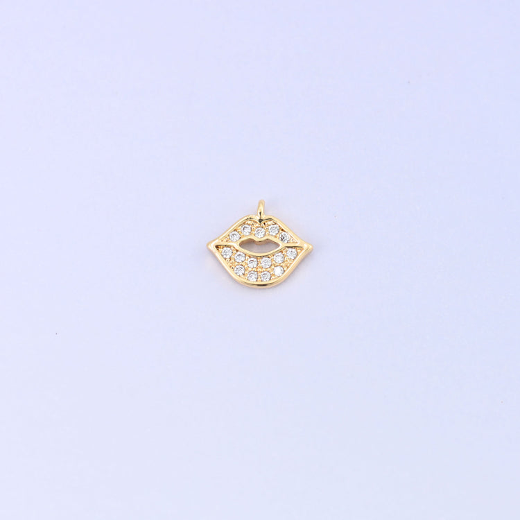 Small gold charms in a lip shape, 18K gold plated brass with clear cubic zirconia, single charm front view
