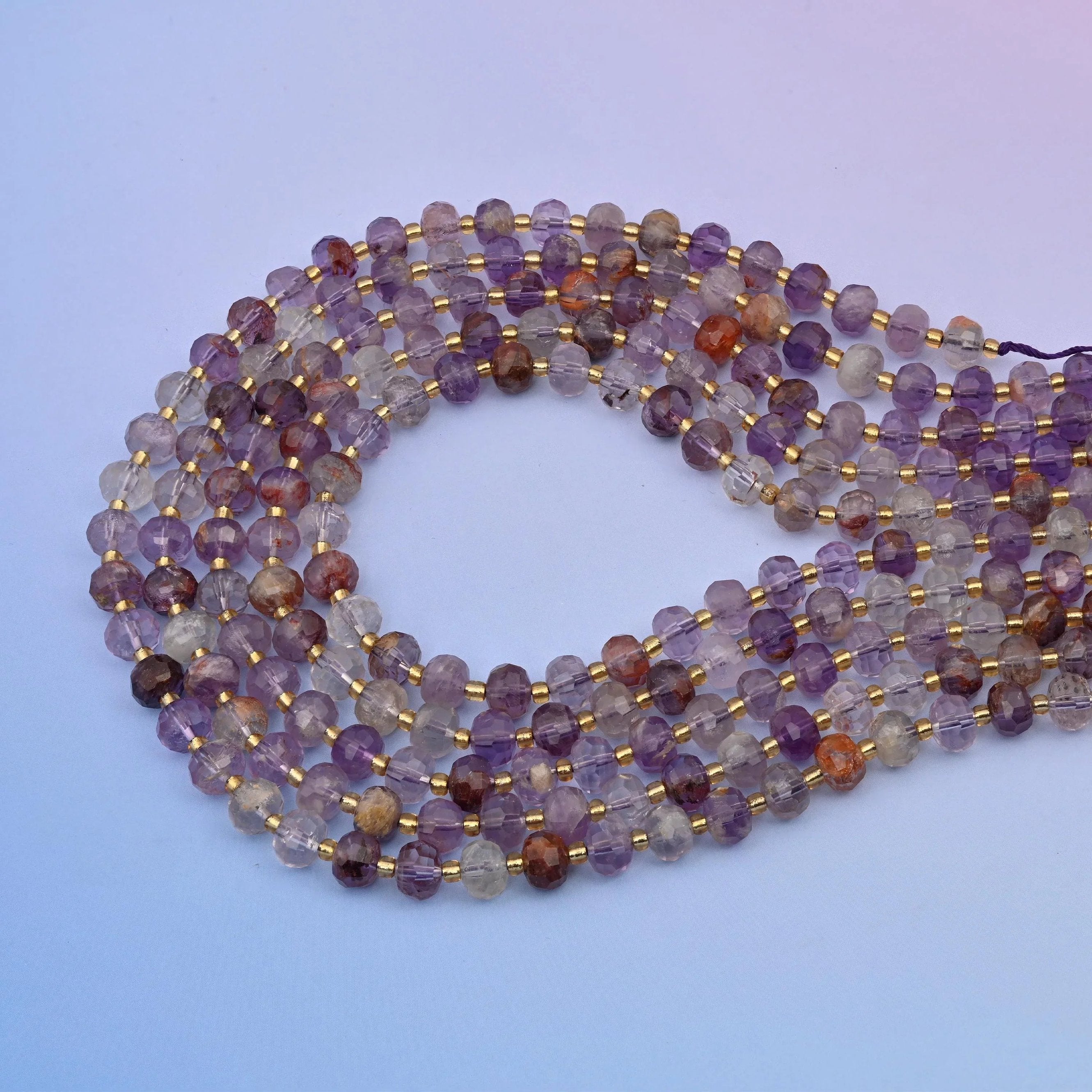 Amethyst Phantom Quartz (Super 7) rondelle beads in pale lilac to grape violet