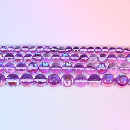 Mystic Aura beads in orchid purple glass with a blue-and-pink aurora band