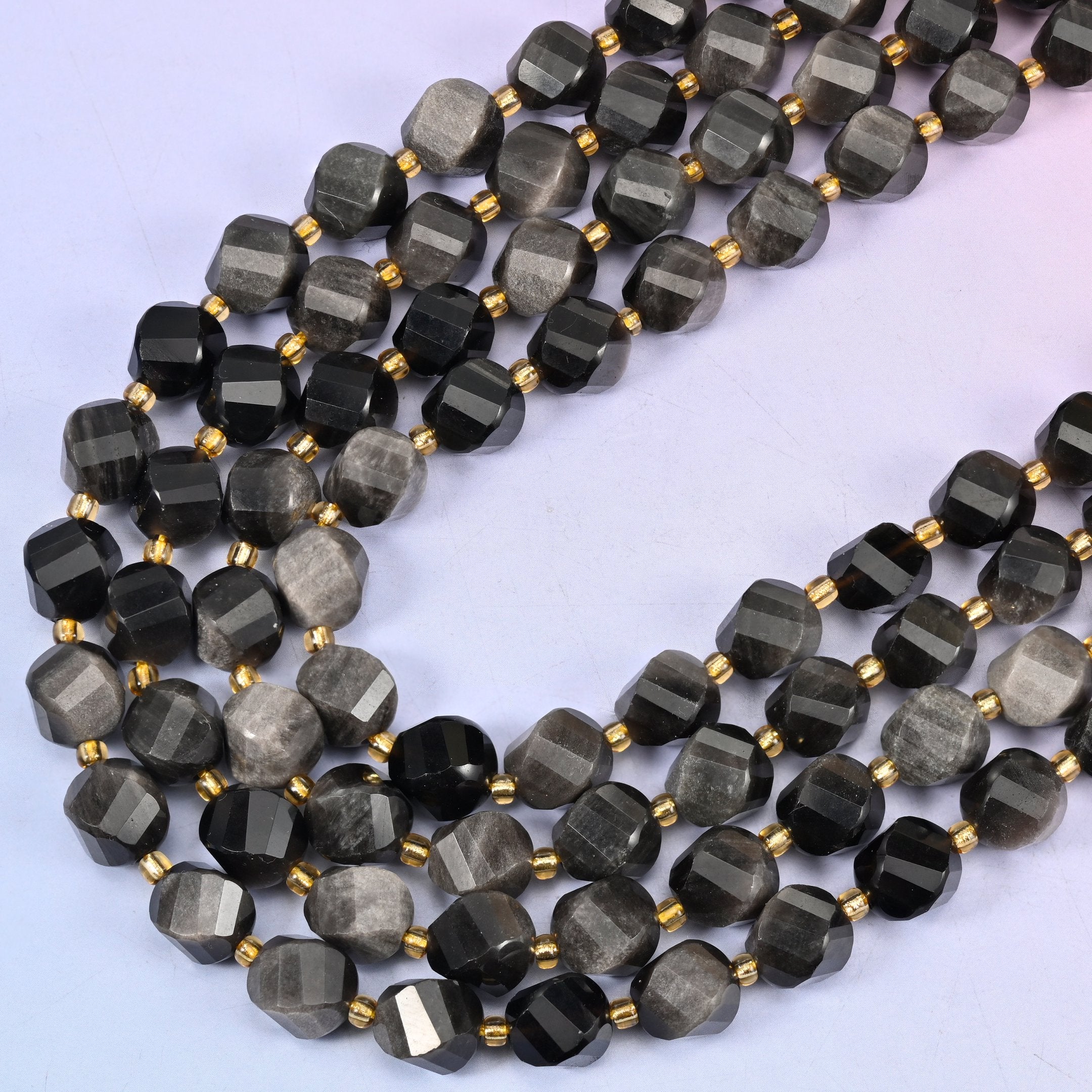 Silver Obsidian natural stone beads, many-sided spiral twist cut catching light on every facet, 10mm