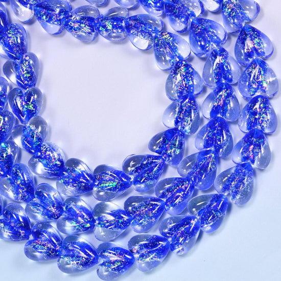 Transparent cobalt blue glass heart beads with iridescent glitter