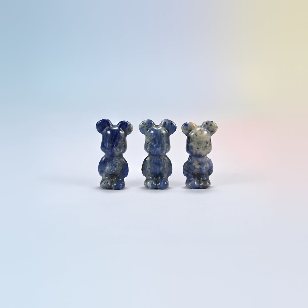 Three 1.5 inch sodalite power bear crystal carvings, deep blue natural stone with white veins