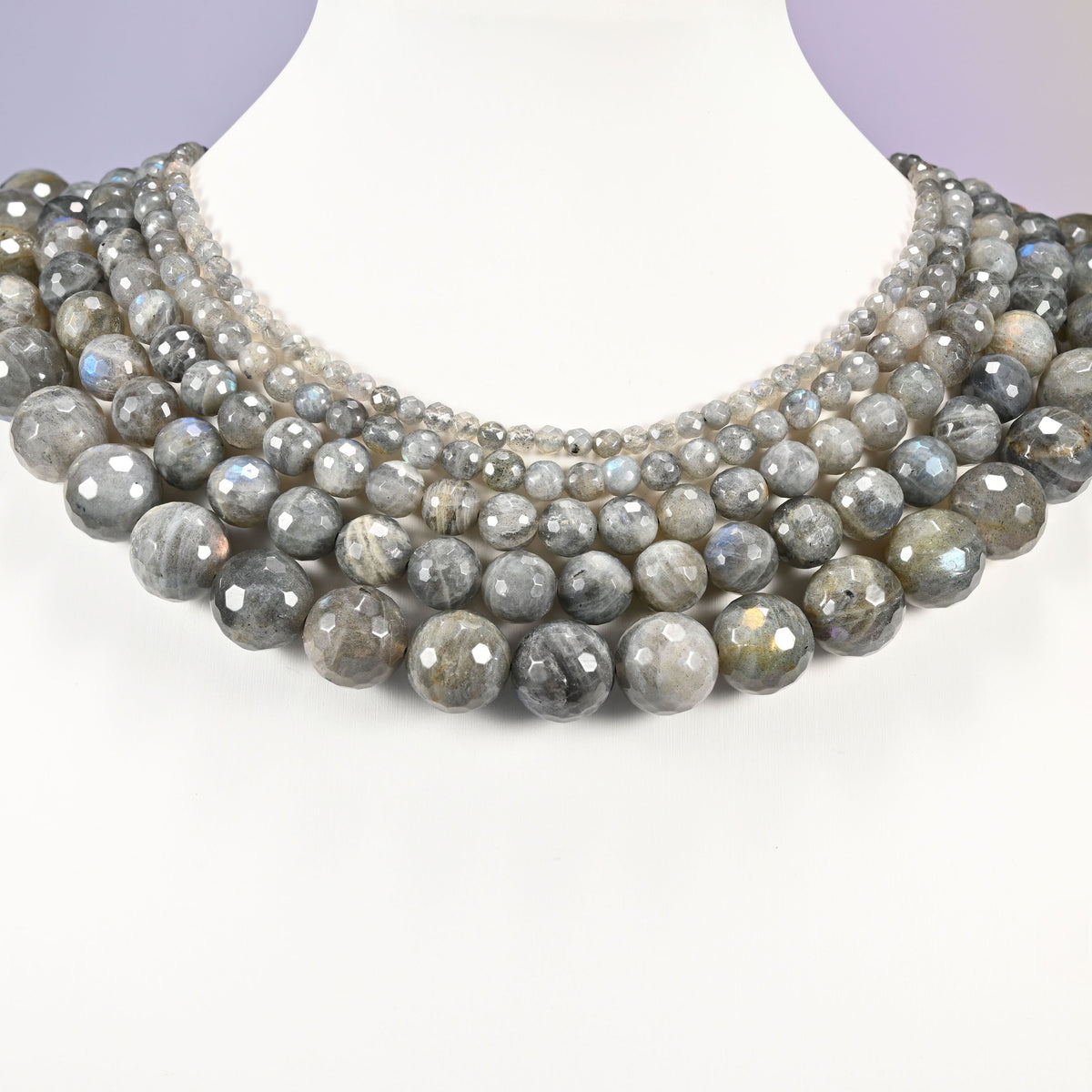 Gray Labradorite faceted round beads layered as a collar, several strands showing the 4mm through 14mm sizes together
