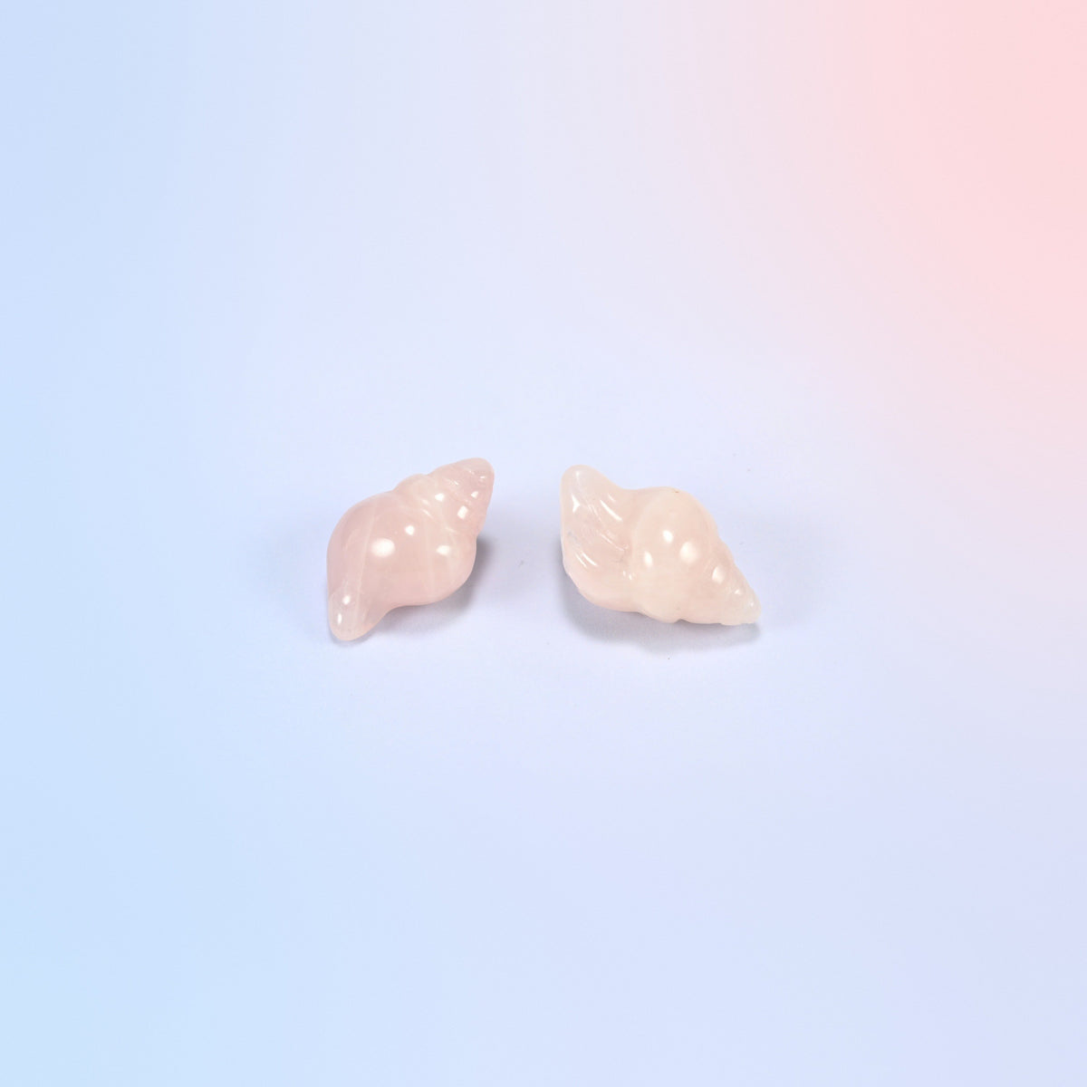 Two natural rose quartz conch shell crystal carvings, 1.5 inch, light pink