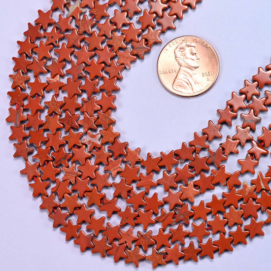 Flat star cut red jasper beads