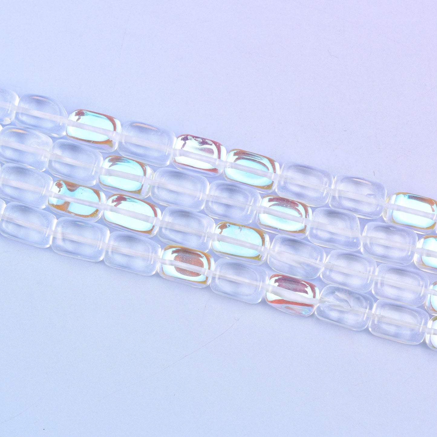 Clear Mystic Aura Rectangle Glass Beads 10-12mm in clear with a rainbow iridescent glow