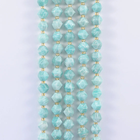 Faceted rhombus gemstone beads, eight flat planes per bead.