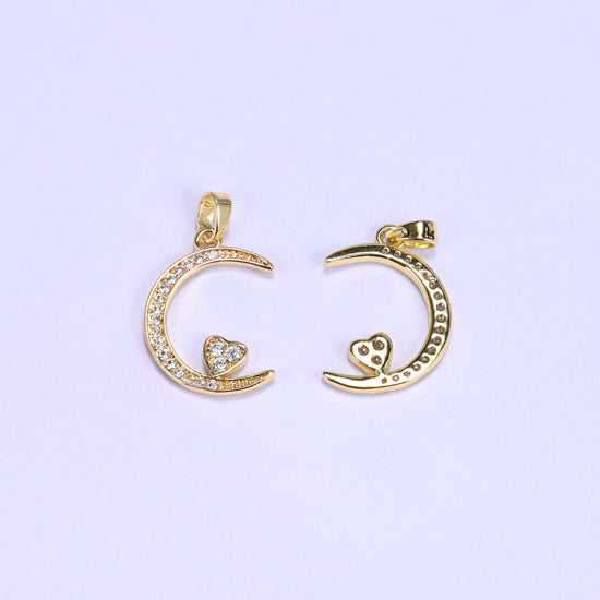 Gold moon heart zirconia charms front and back, one crescent pendant face up beside one flipped to the plain reverse.