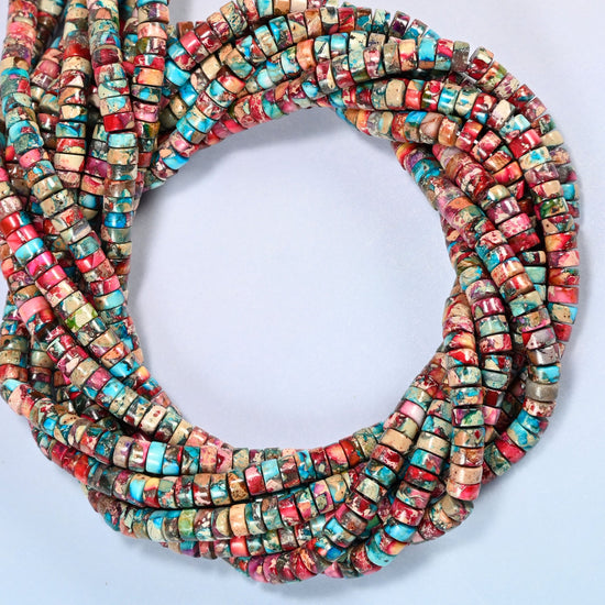 Dyed pink blue sea sediment jasper heishi disc beads 2x4mm coiled into overlapping loops, whole strands of raspberry pink, red and turquoise discs
