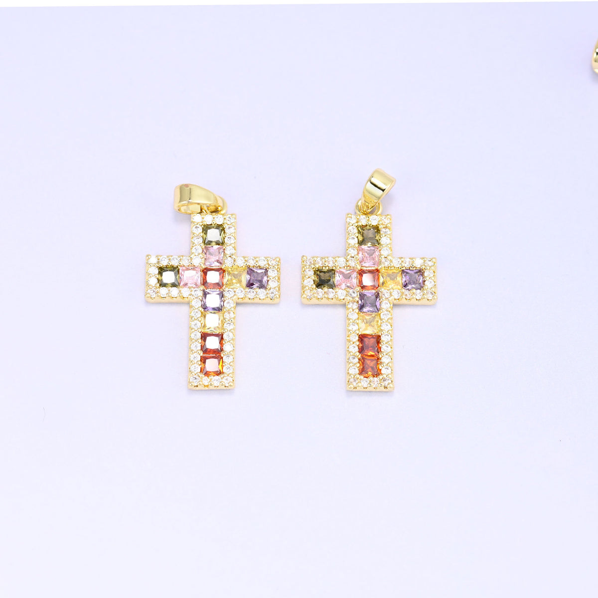 Zirconia cross charms, two gold plated pendants shown front on with the flat bail at the top