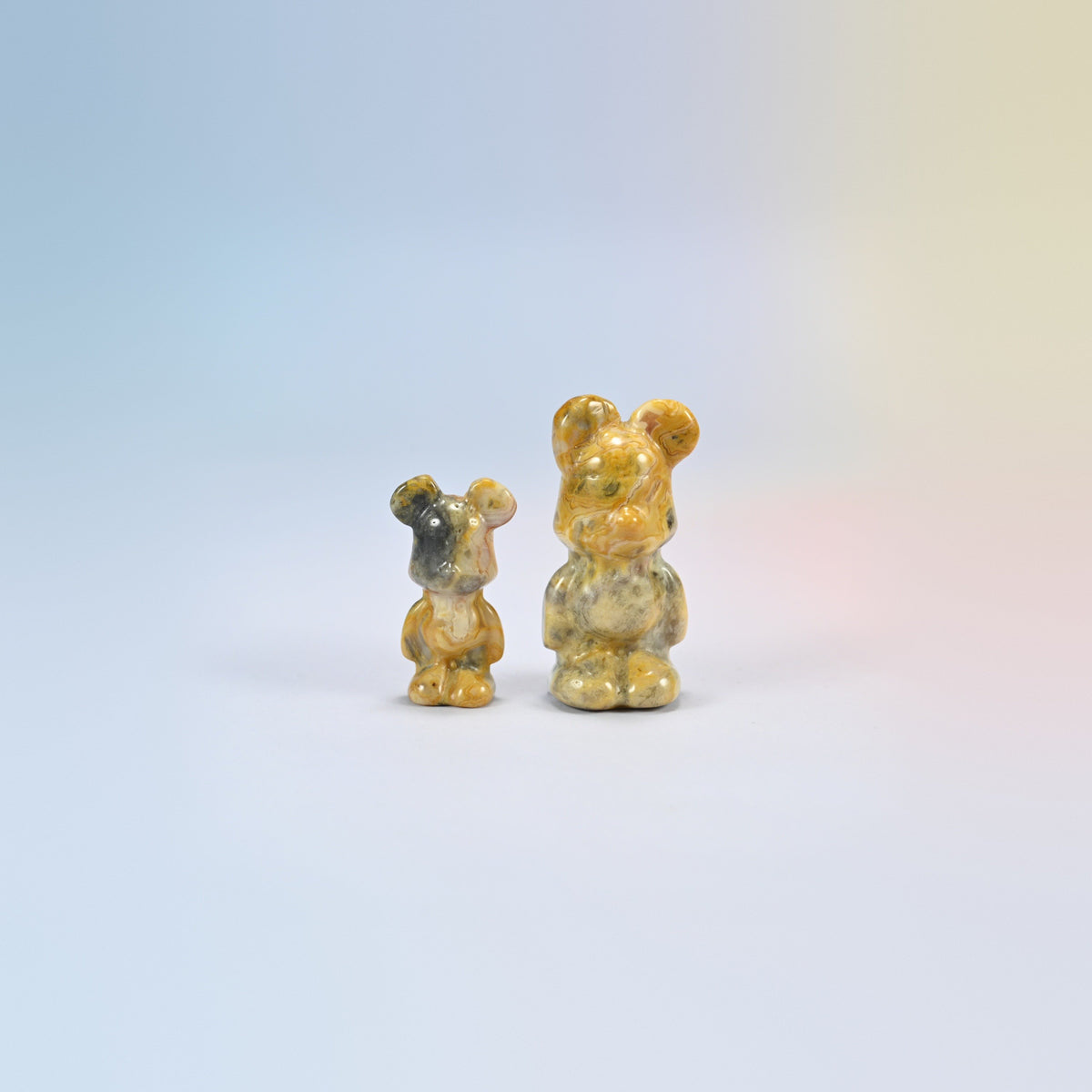 A 1.5 inch and a 2 inch crazy agate power bear crystal carving, golden yellow and gray natural agate