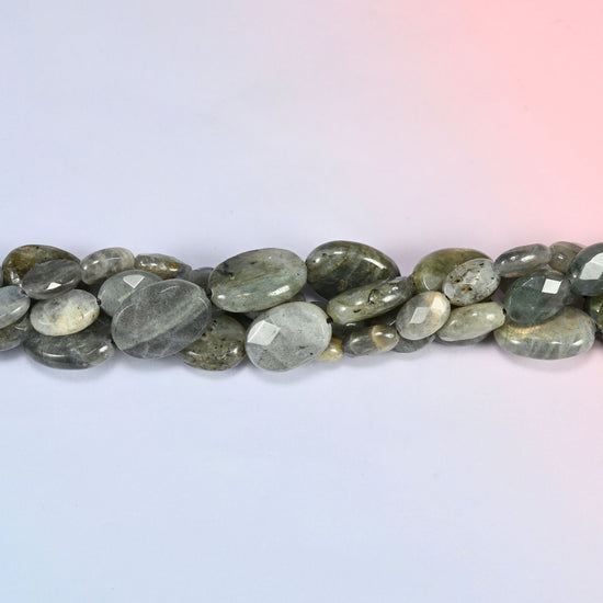 Gray Labradorite faceted oval beads in a single close run, faceting worked across the face of each oval