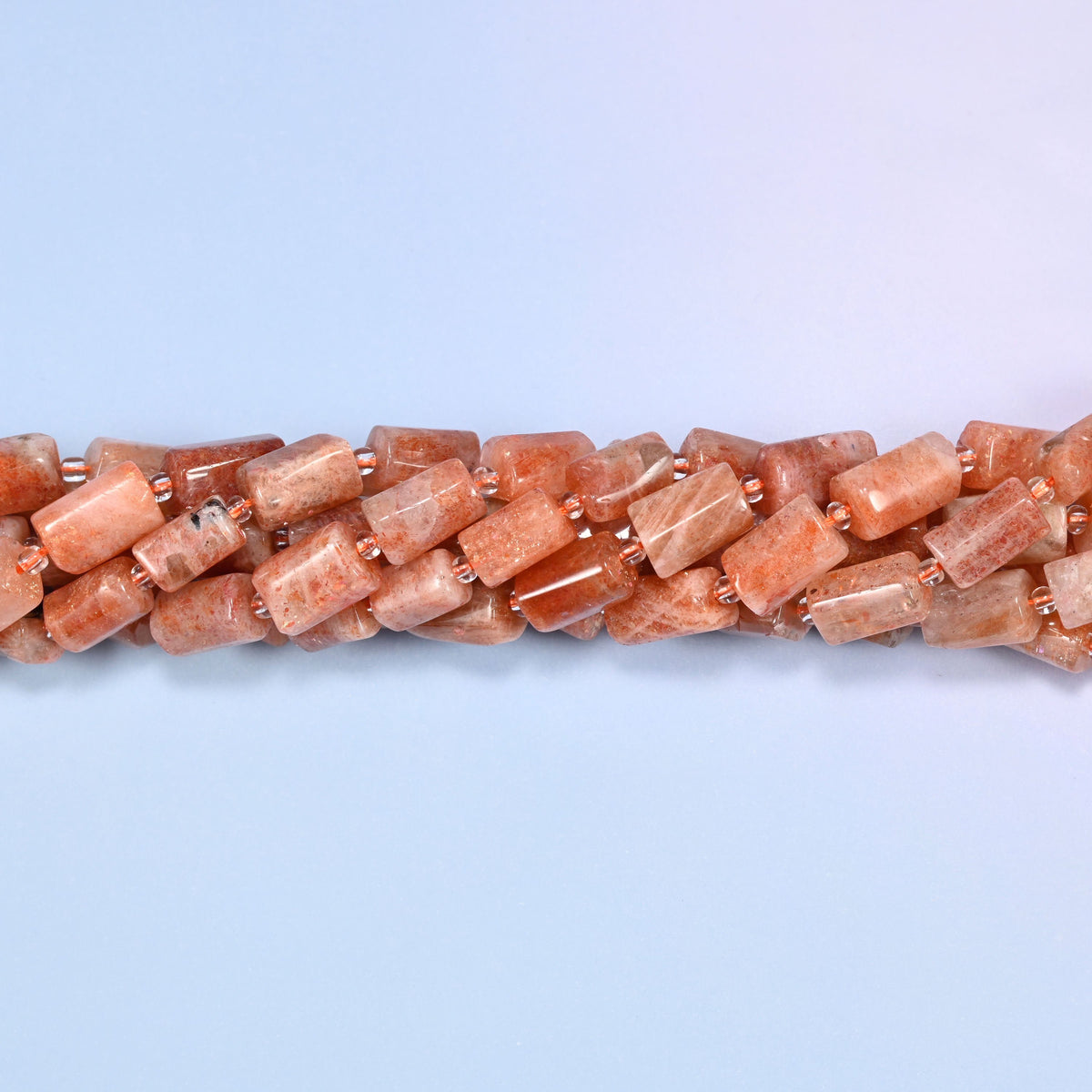 Natural Golden Strawberry Quartz faceted tube beads featuring warm golden, coral and sunset orange tones.