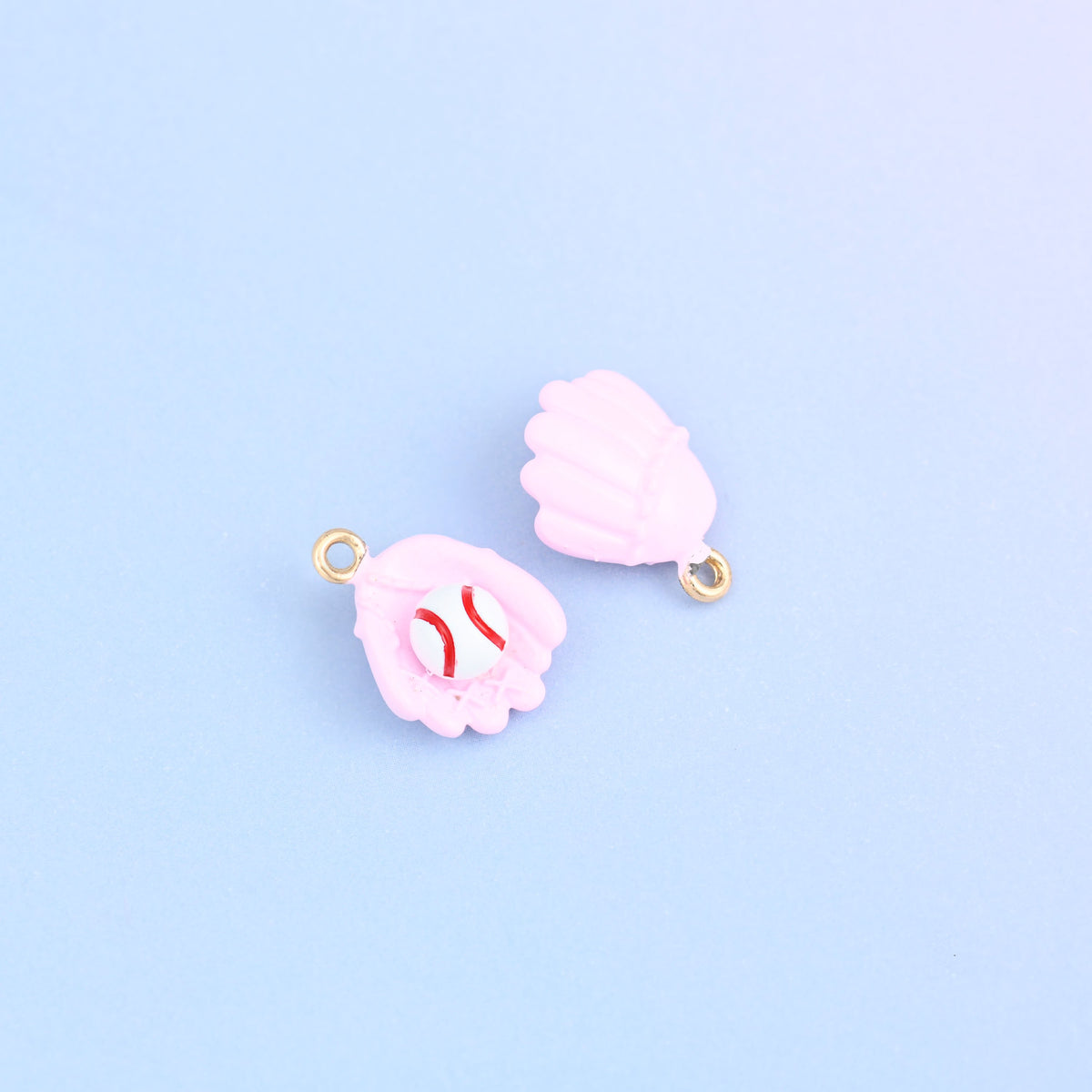 Two pink baseball glove charms, front and back, 7.66mm thick and moulded on both sides.