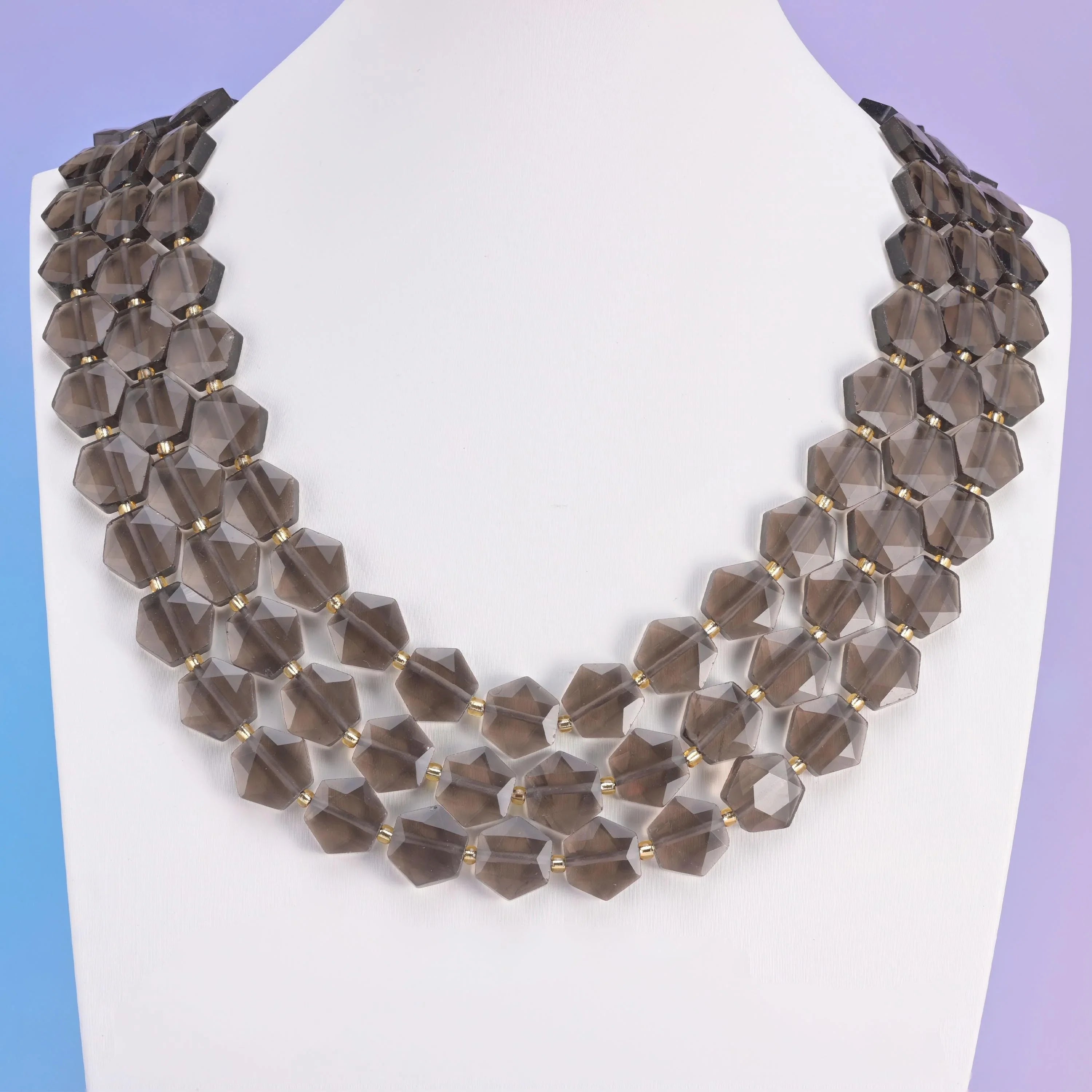 Ice Obsidian in smoky grey-brown, translucent amber where light passes through.