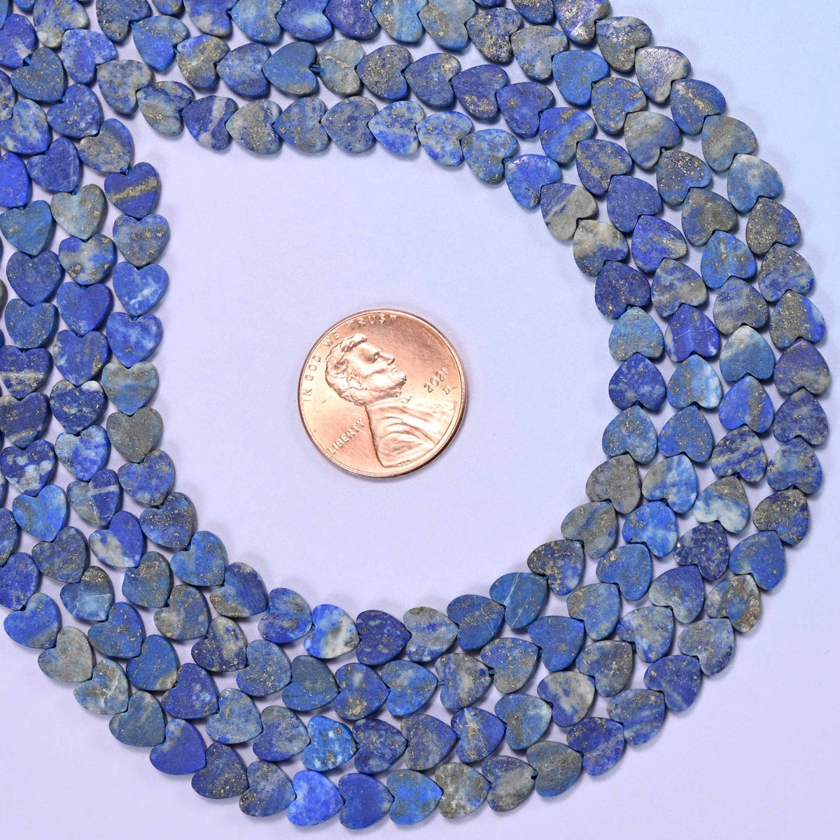 Matte lapis lazuli flat heart beads, approximately 68 per strand