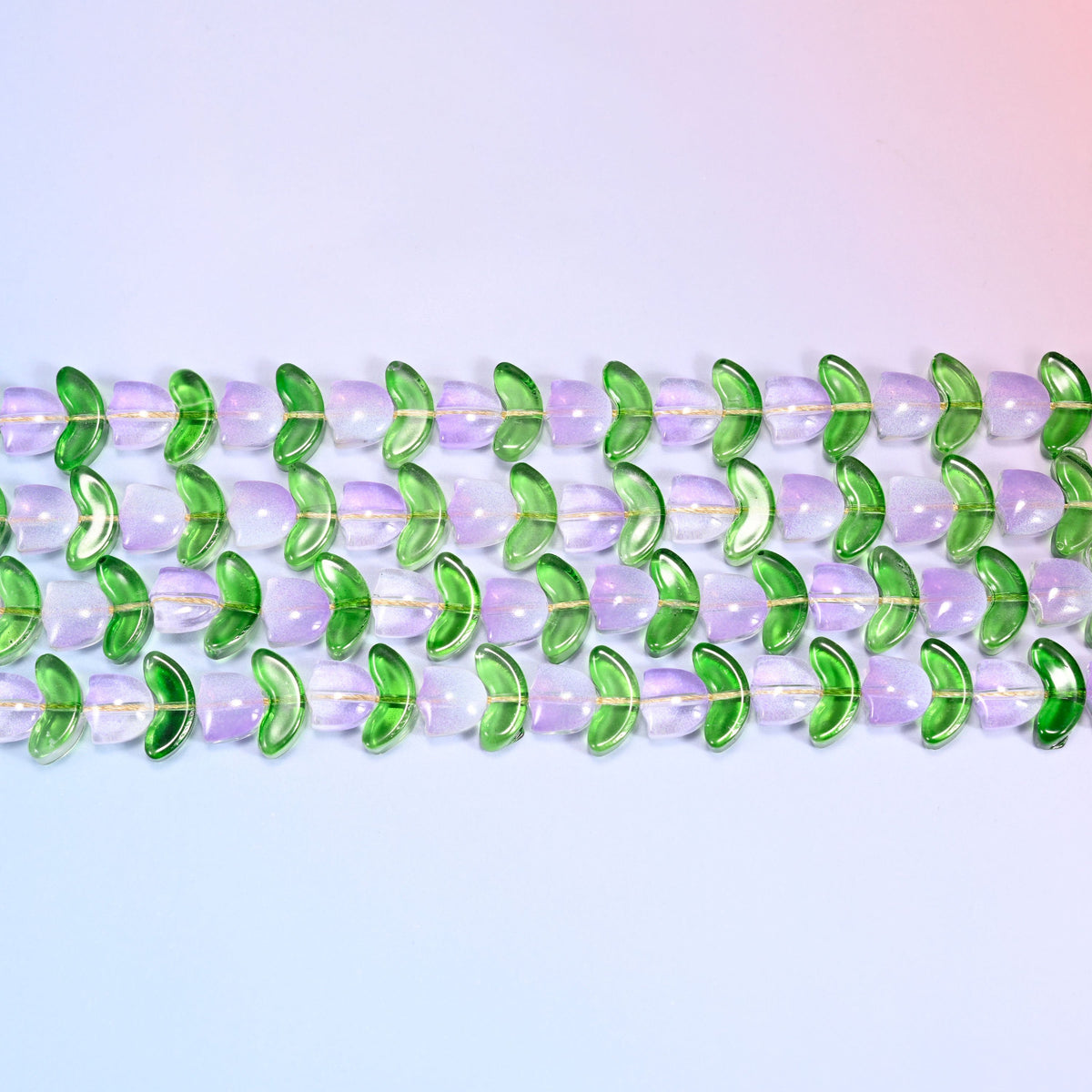 Lavender Tulip Flower Glass Beads paired with green leaf-shaped glass beads.