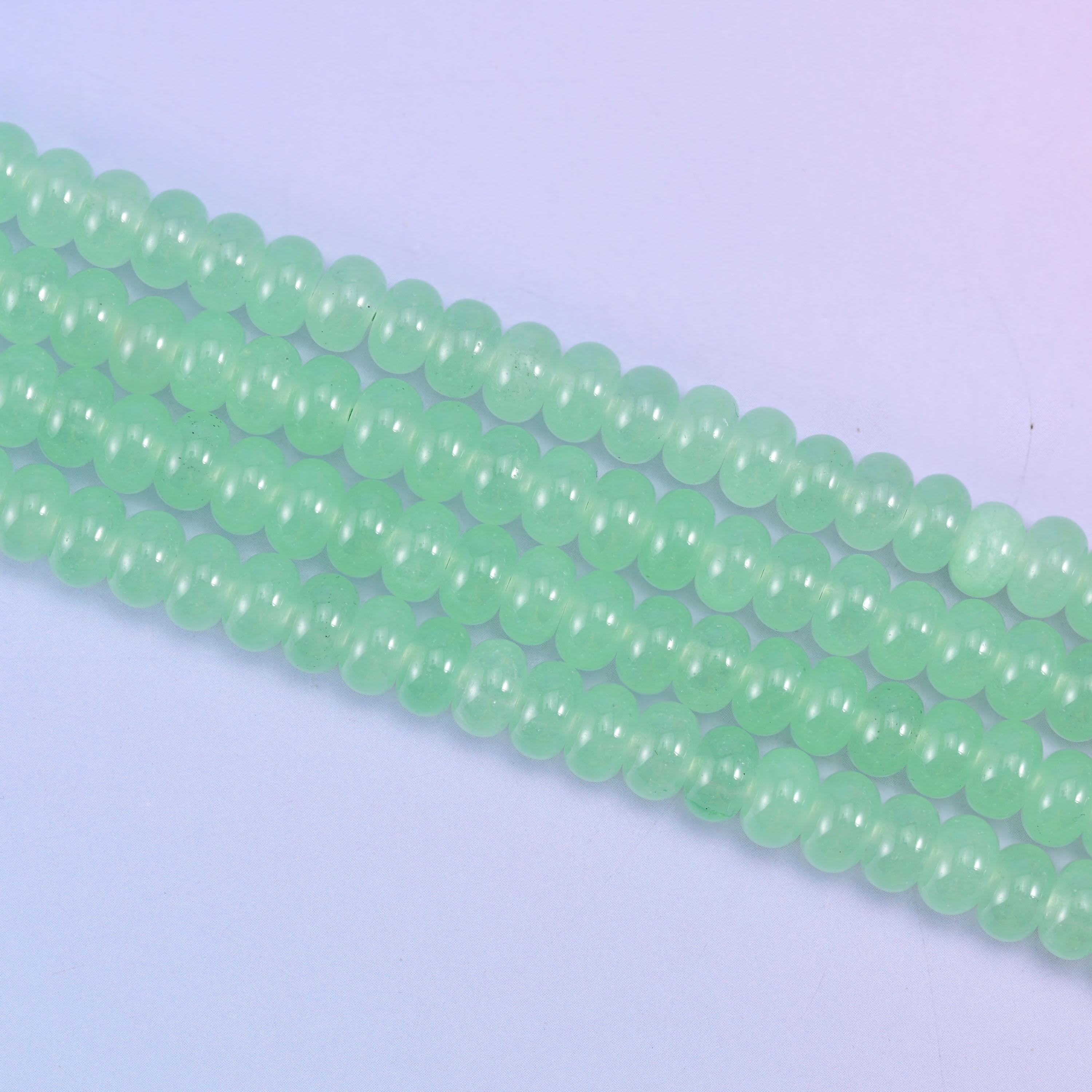 Light Green Dyed Jade beads, waxy and faintly translucent