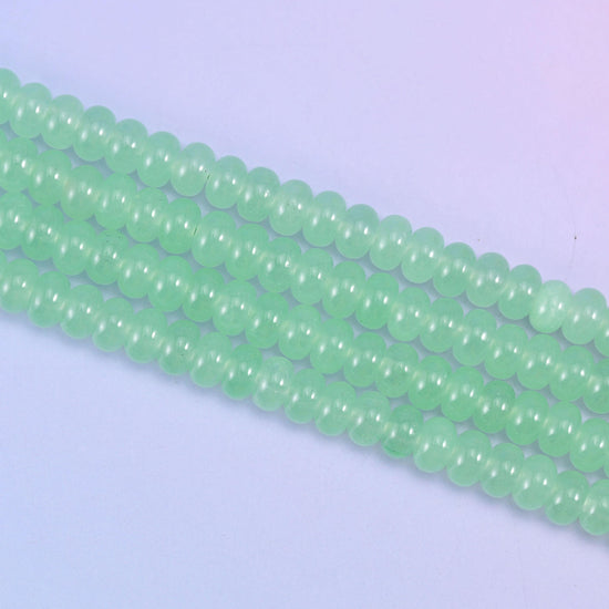 Light Green Dyed Jade beads, waxy and faintly translucent