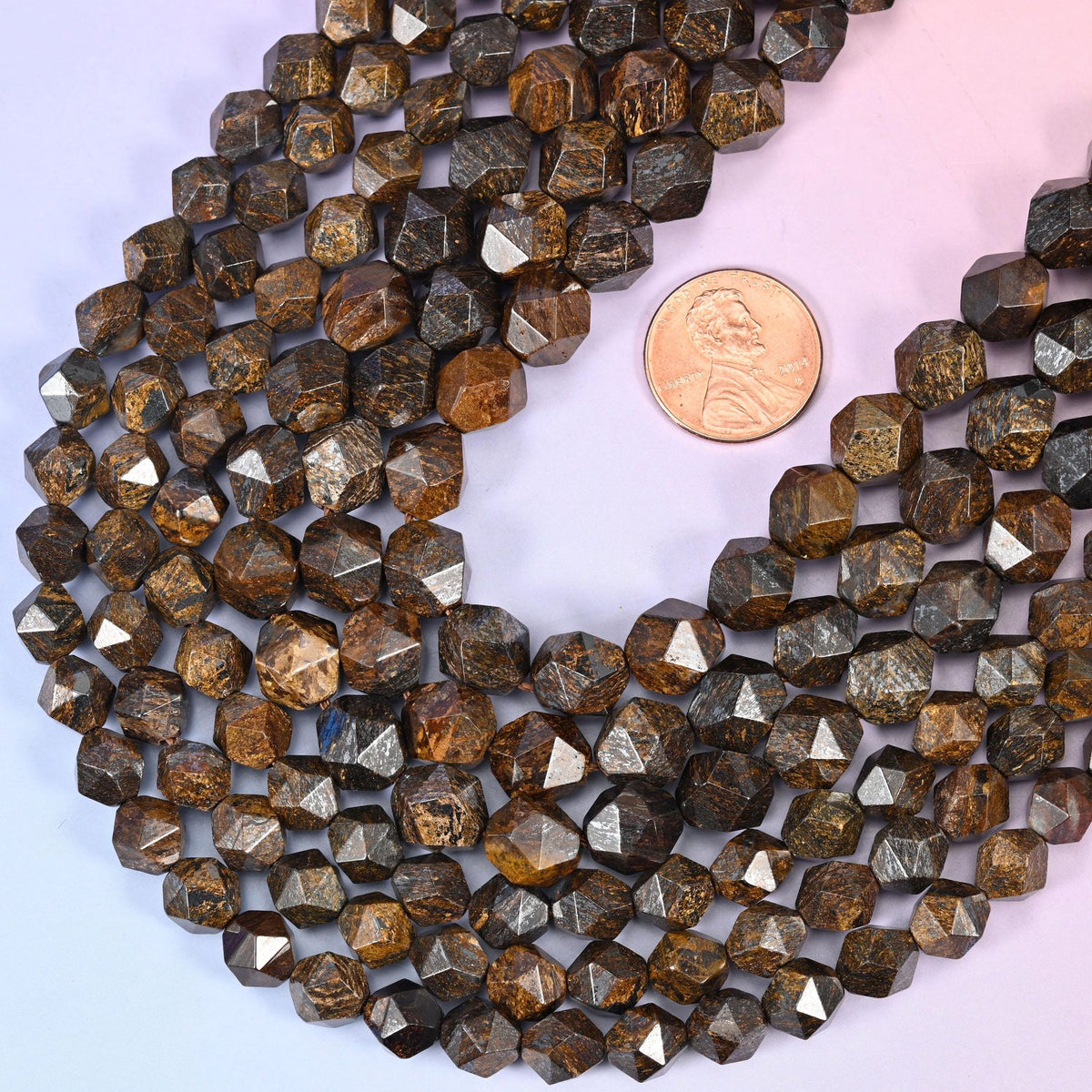 Faceted diamond star cut round cut bronzite beads